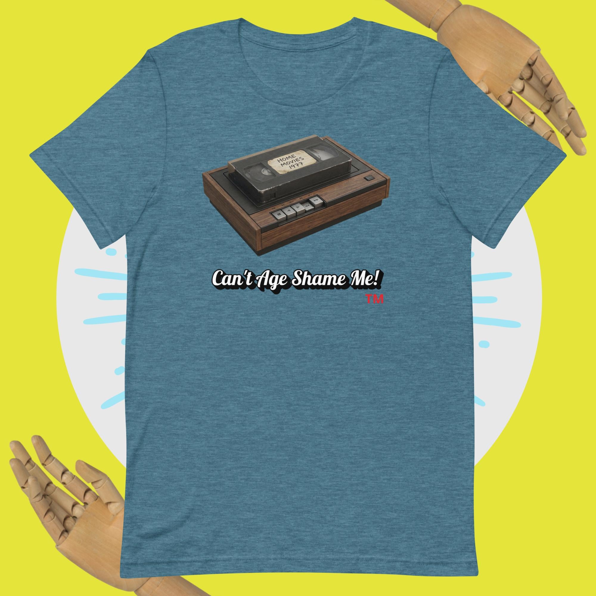 heather teal t-shirt with a cassette tape graphic and text 'Can't Age Shame Me!' on a yellow background.