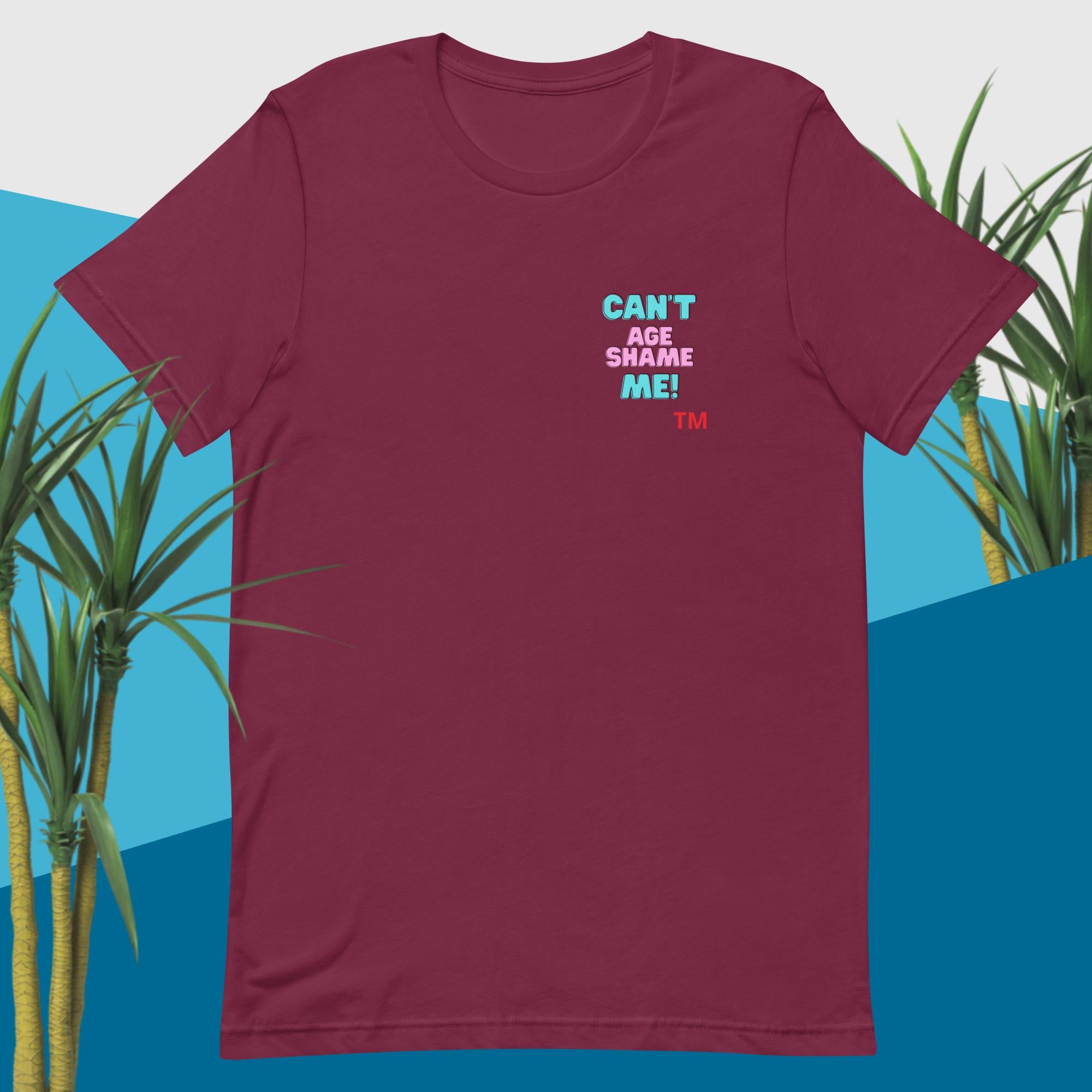 Maroon t-shirt with colorful text “'Can't Age Shame Me” on a yellow background design with cactus