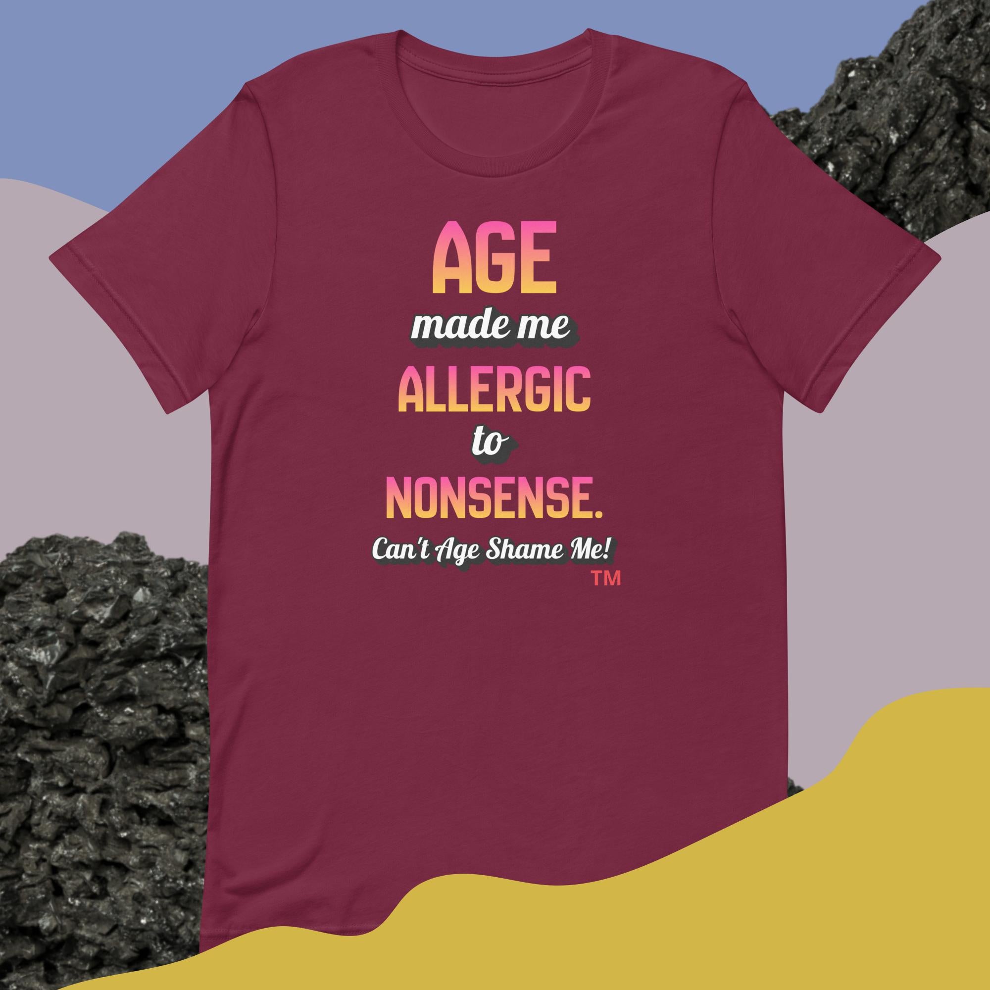 Maroon t-shirt with colorful text on a gradient background