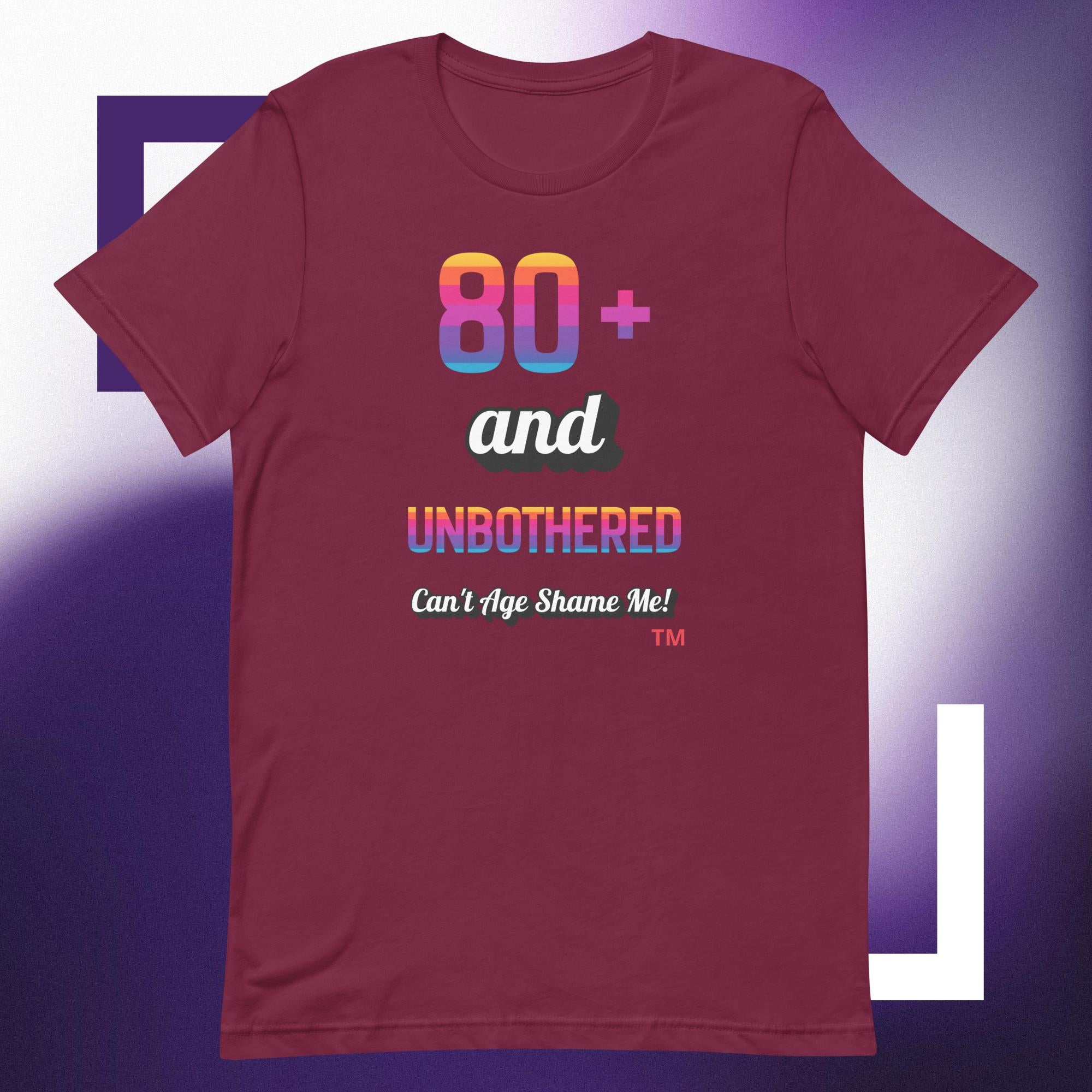 Maroon t-shirt with colorful text design on a purple background