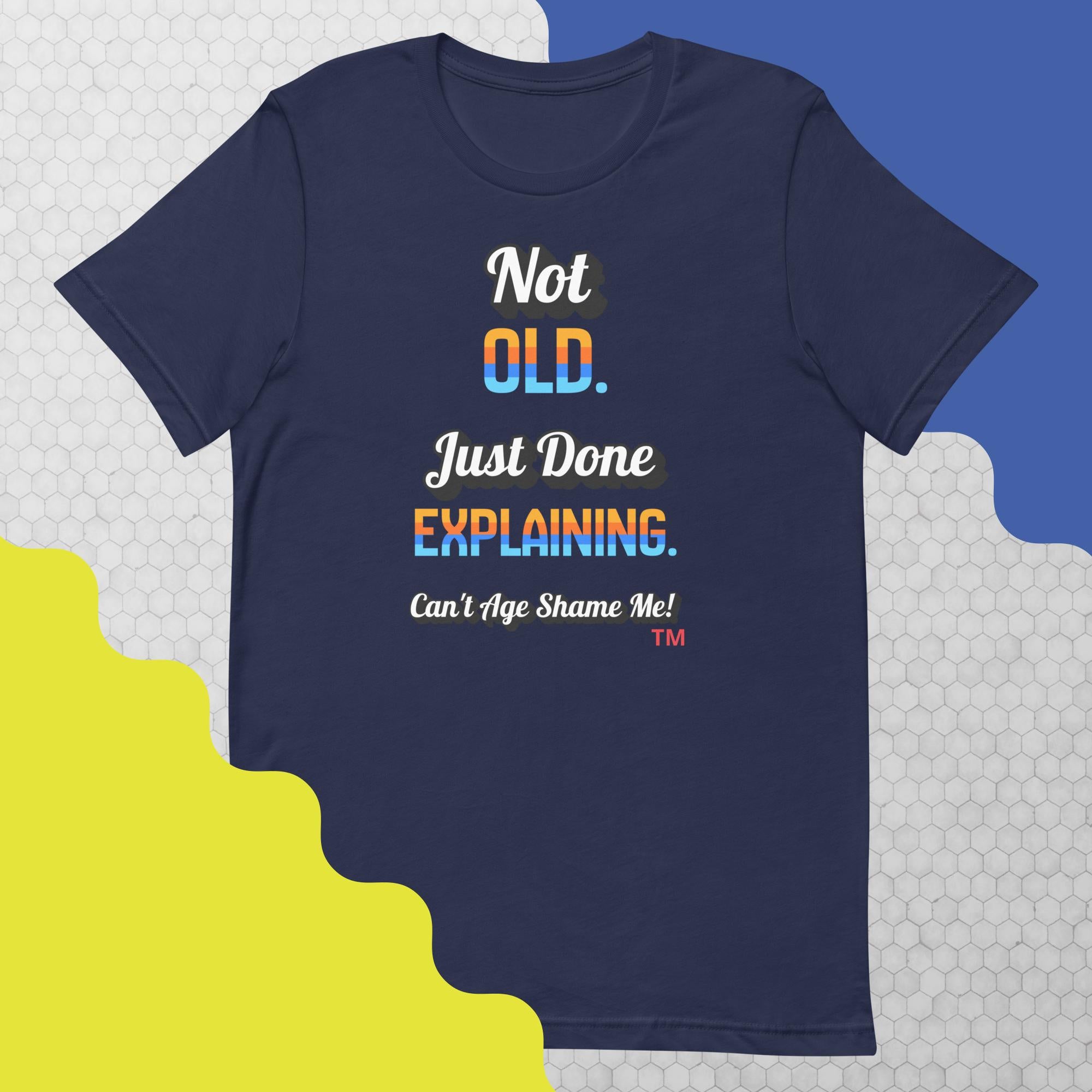 Navy blue t-shirt with colorful text on a geometric patterned background