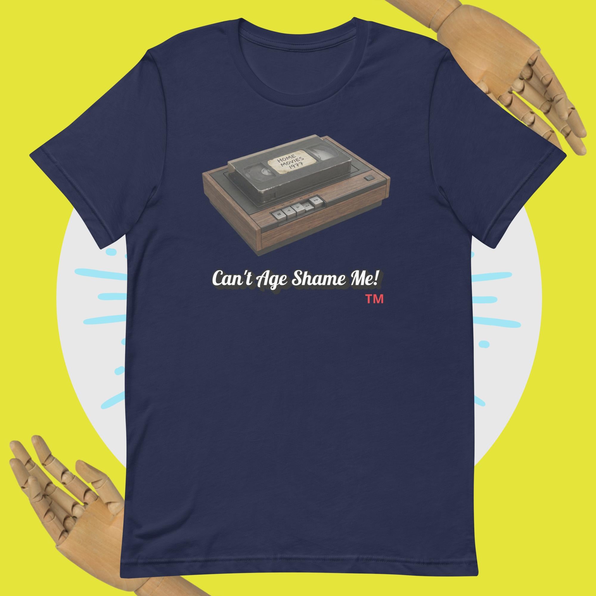 navy  t-shirt with a cassette tape graphic and 'Can't Age Shame Me!' text on a yellow background.
