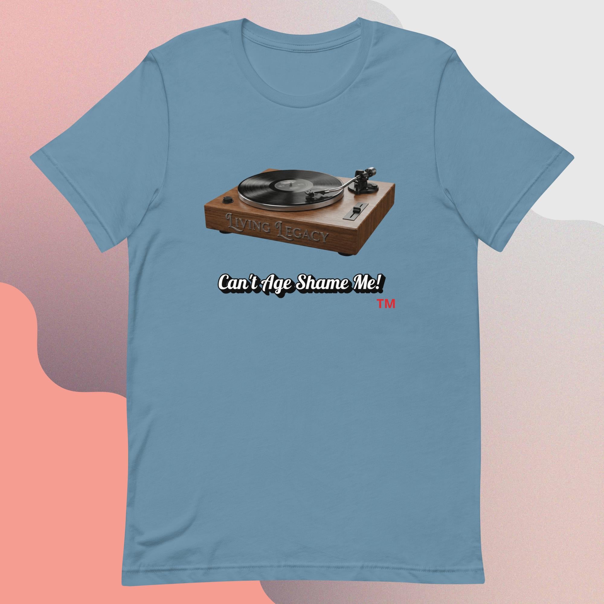 steel blue t-shirt with a graphic of a turntable and text 'Can't Age Shame Me!' on a gradient background.