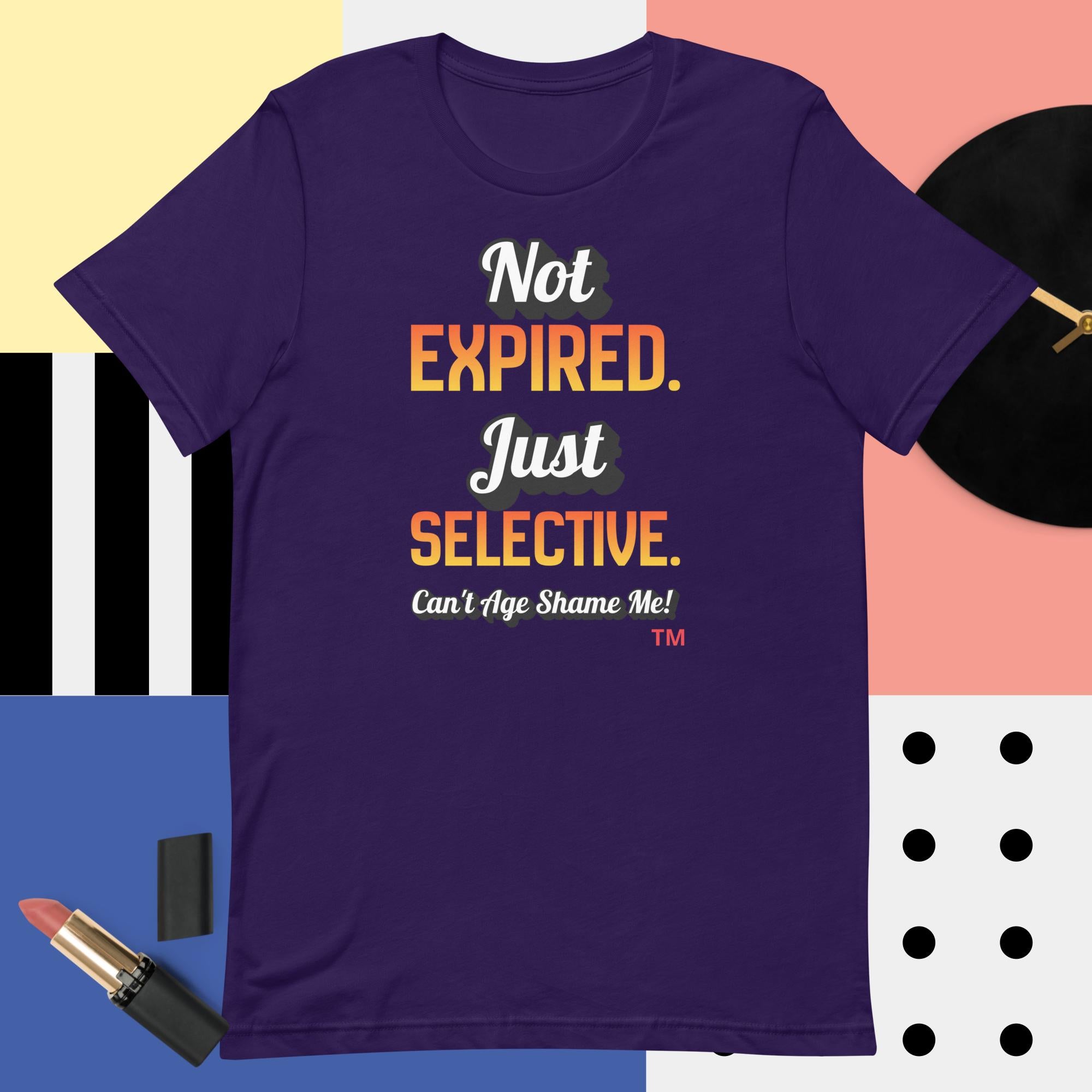 Purple t-shirt with colorful text on a multicolored background