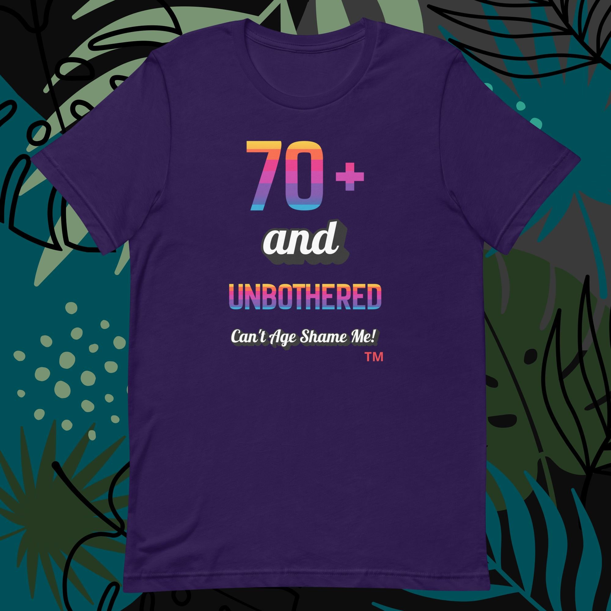 Purple t-shirt with colorful text design on a decorative background