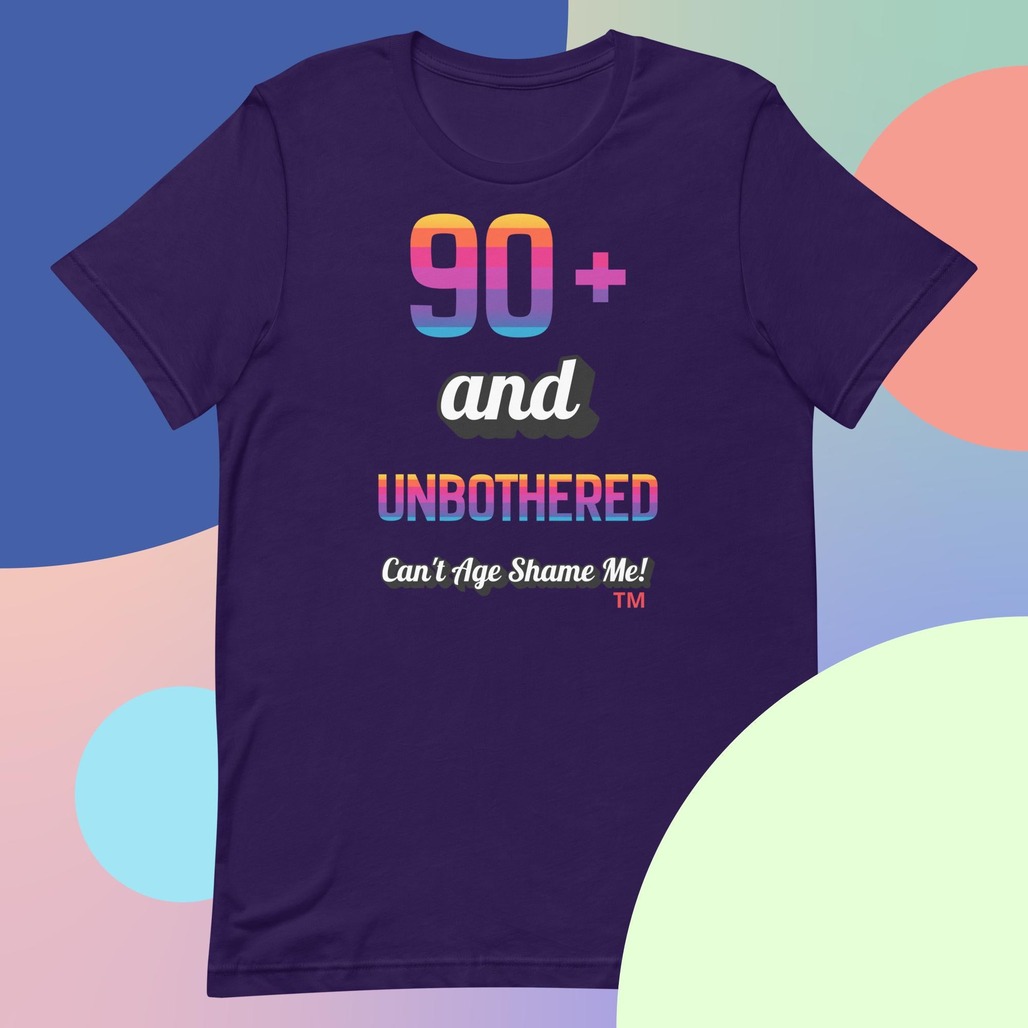 Purple t-shirt with colorful text design on a multicolored background