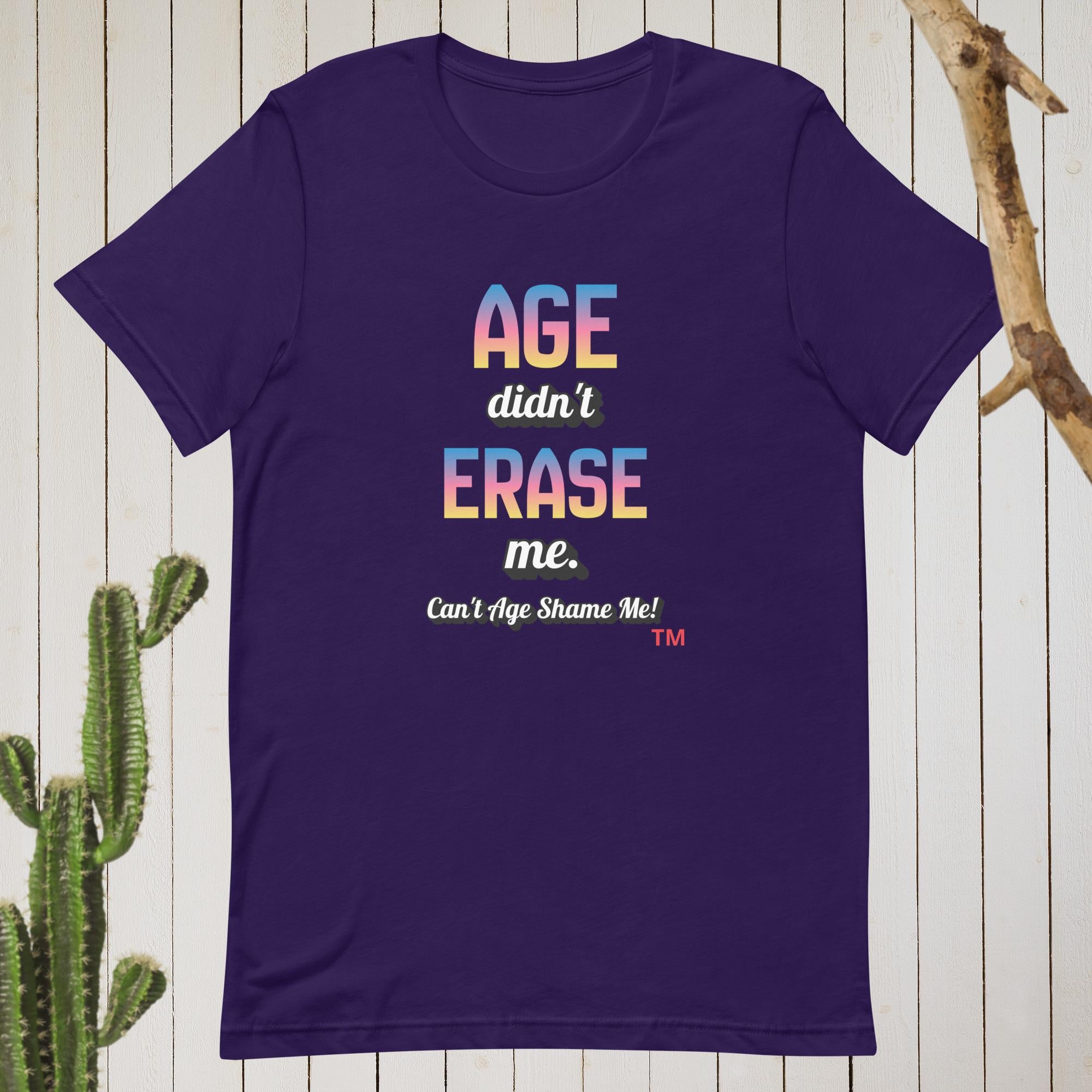 Purple t-shirt with colorful text on a wooden background