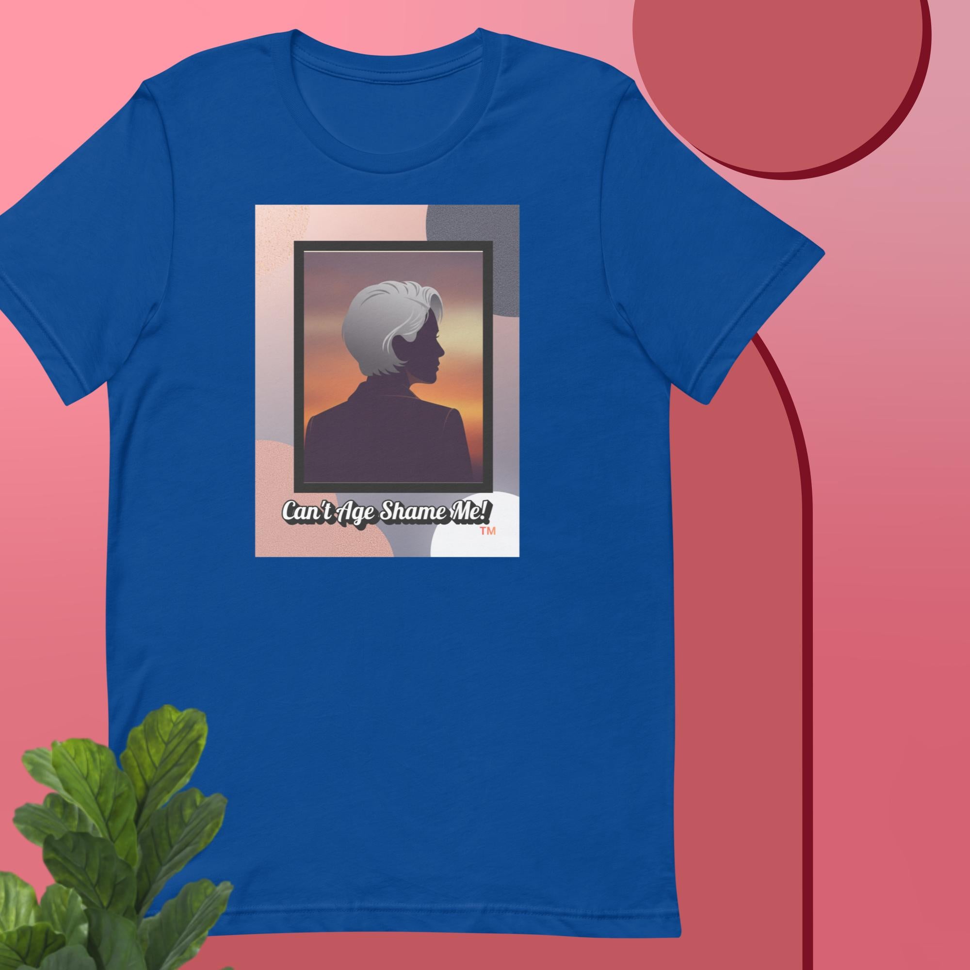 Royal Blue t-shirt with a graphic design featuring a woman with gray hair silhouette and text: Can’t Age Shame Me! on a pink background.


