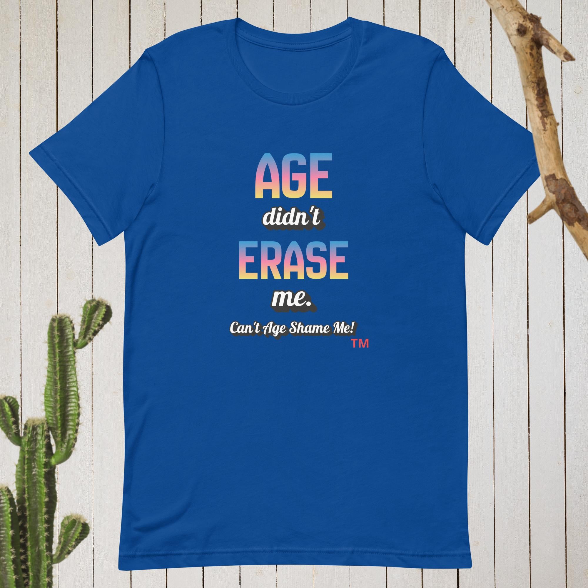 Blue t-shirt with colorful text on a wooden background