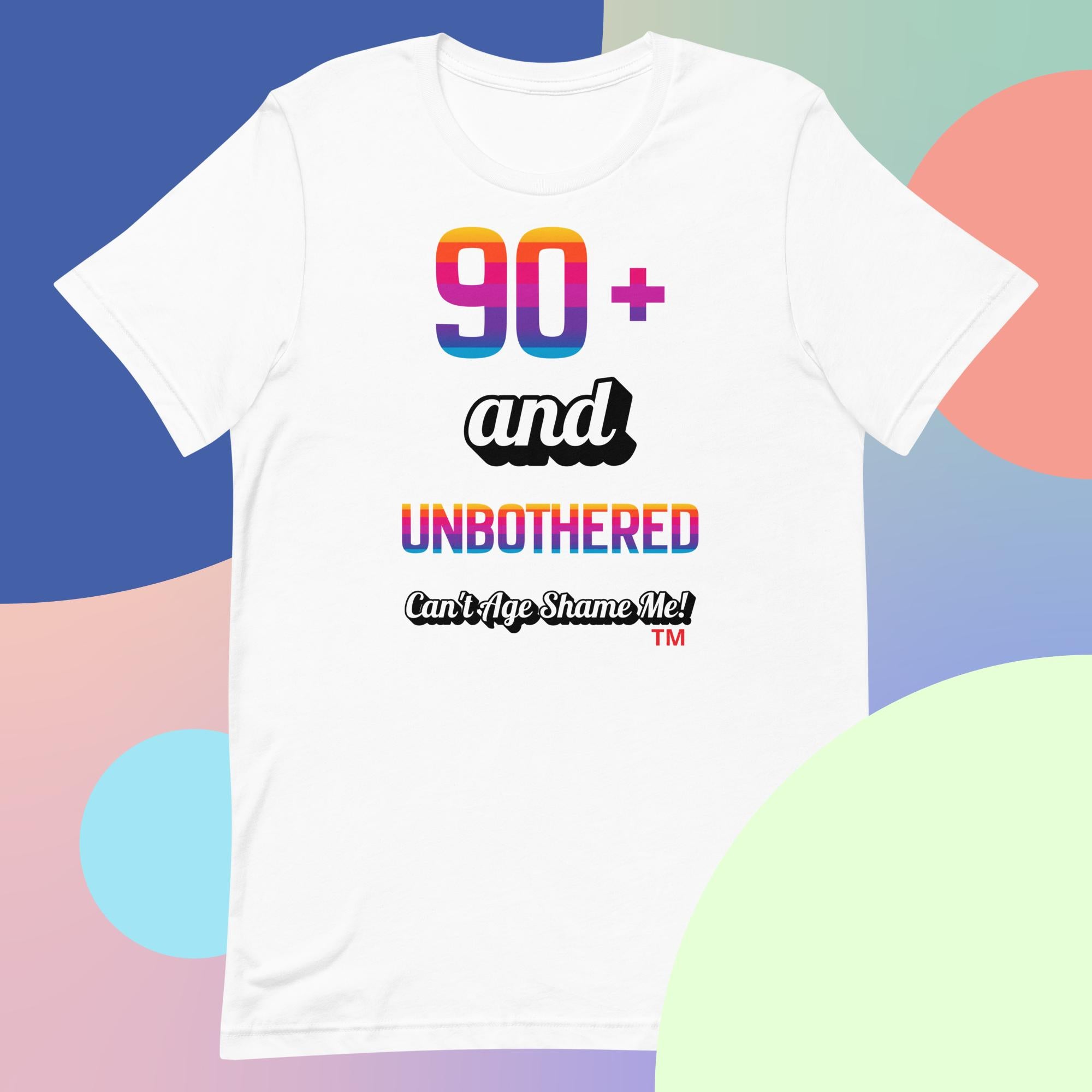 White t-shirt with colorful text design on a multicolored background