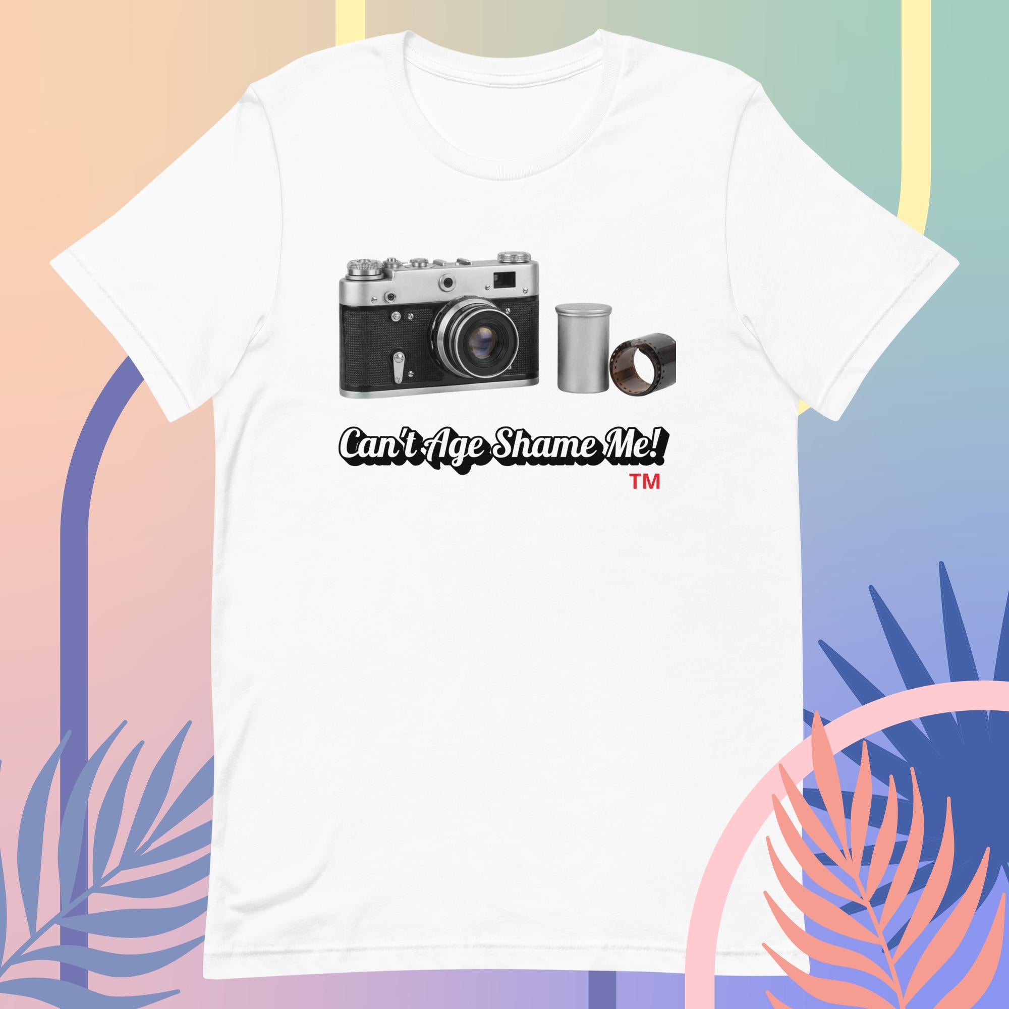 white  t-shirt with a camera graphic and text  Can't Age Shame Me! on a colorful background