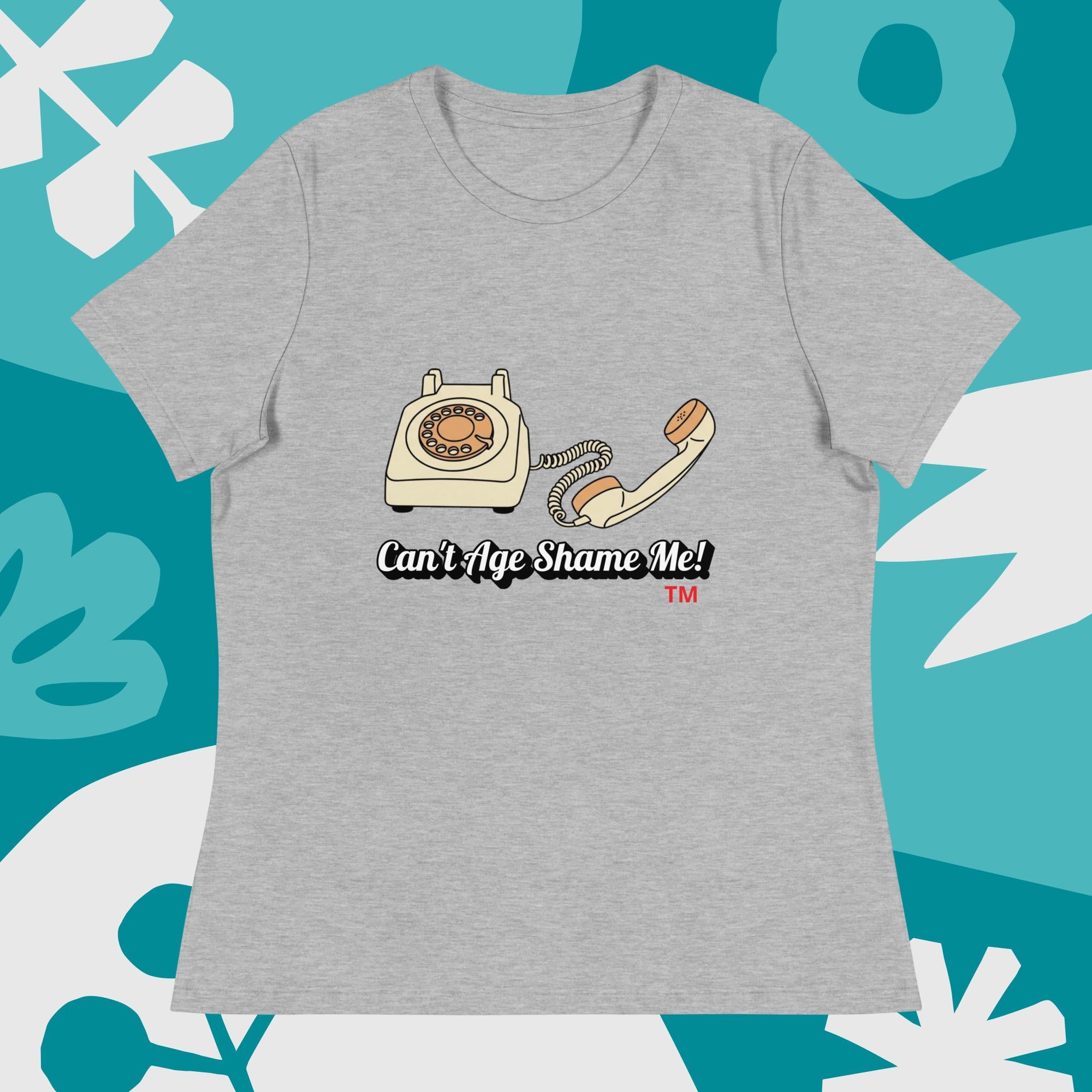 athletic heather t-shirt with a vintage telephone graphic and text  can't age shame me on a blue and white abstract background