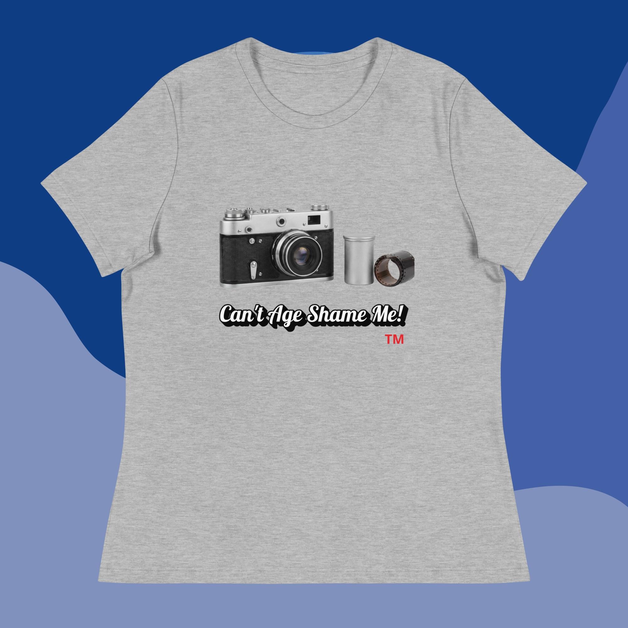 athletic heather t-shirt with a camera graphic and text  can't age shame on on a blue background 