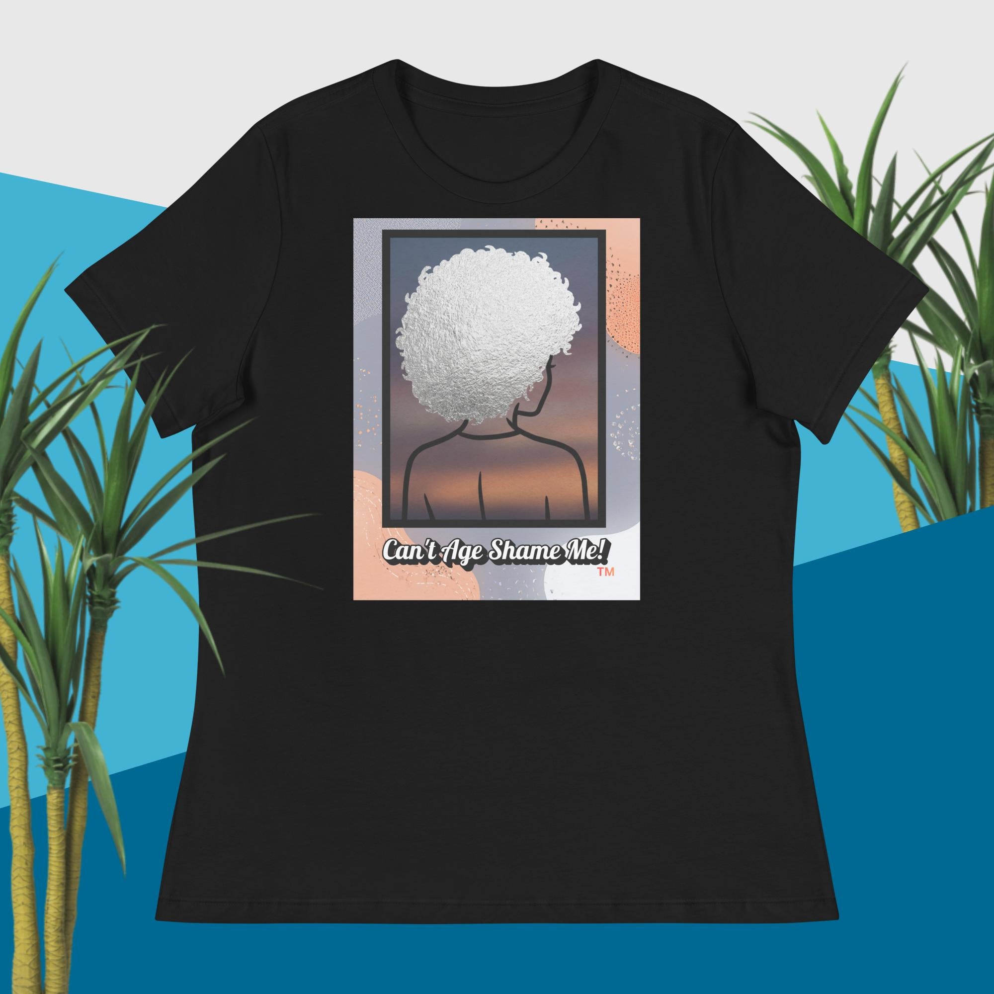 Black  t-shirt with a graphic design of a person with an afro and text 'Can't Age Shame Me!' on a blue and green plant background.