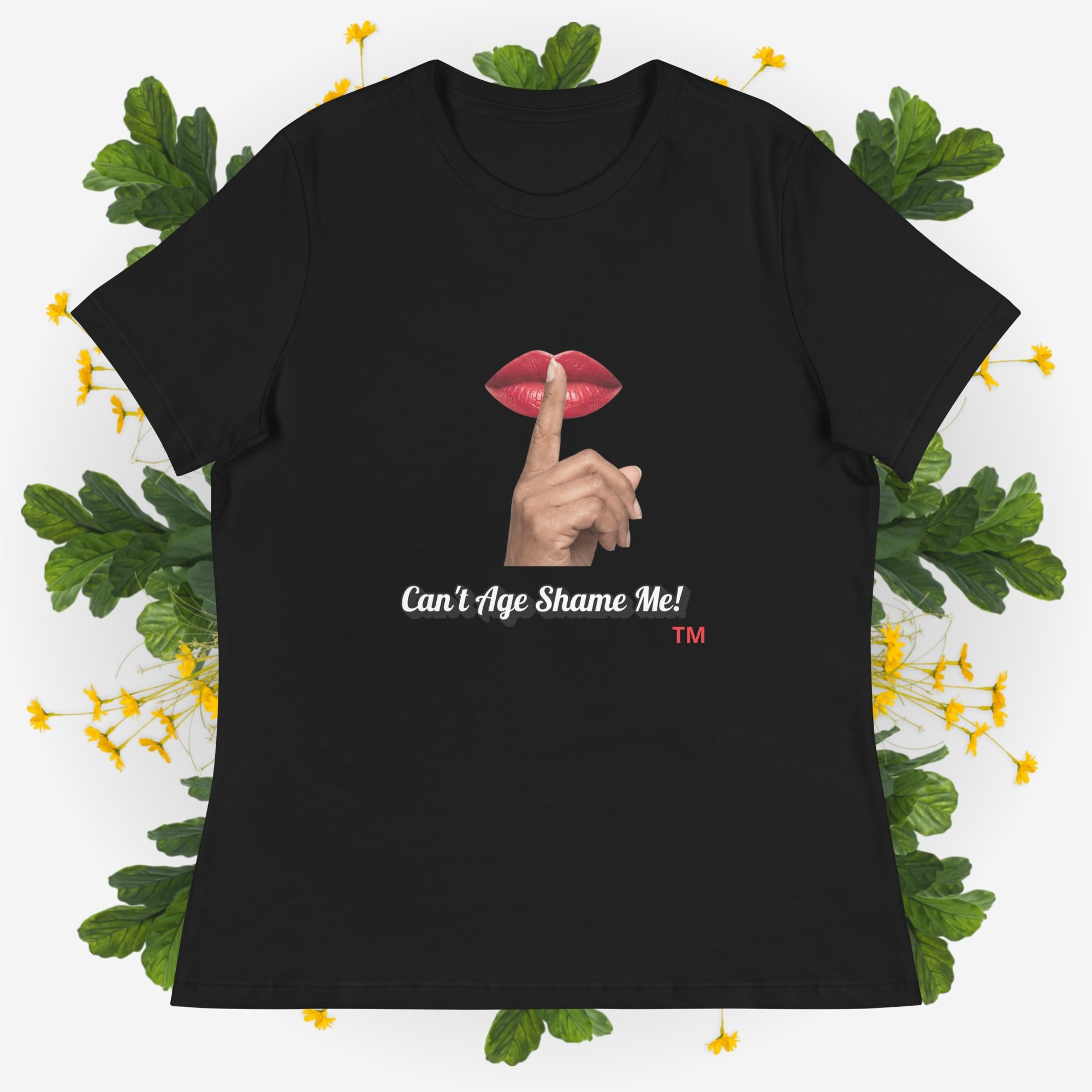 Black t-shirt with graphic design and text 'Can't Age Shame Me' on a decorative background with leaves and flowers.