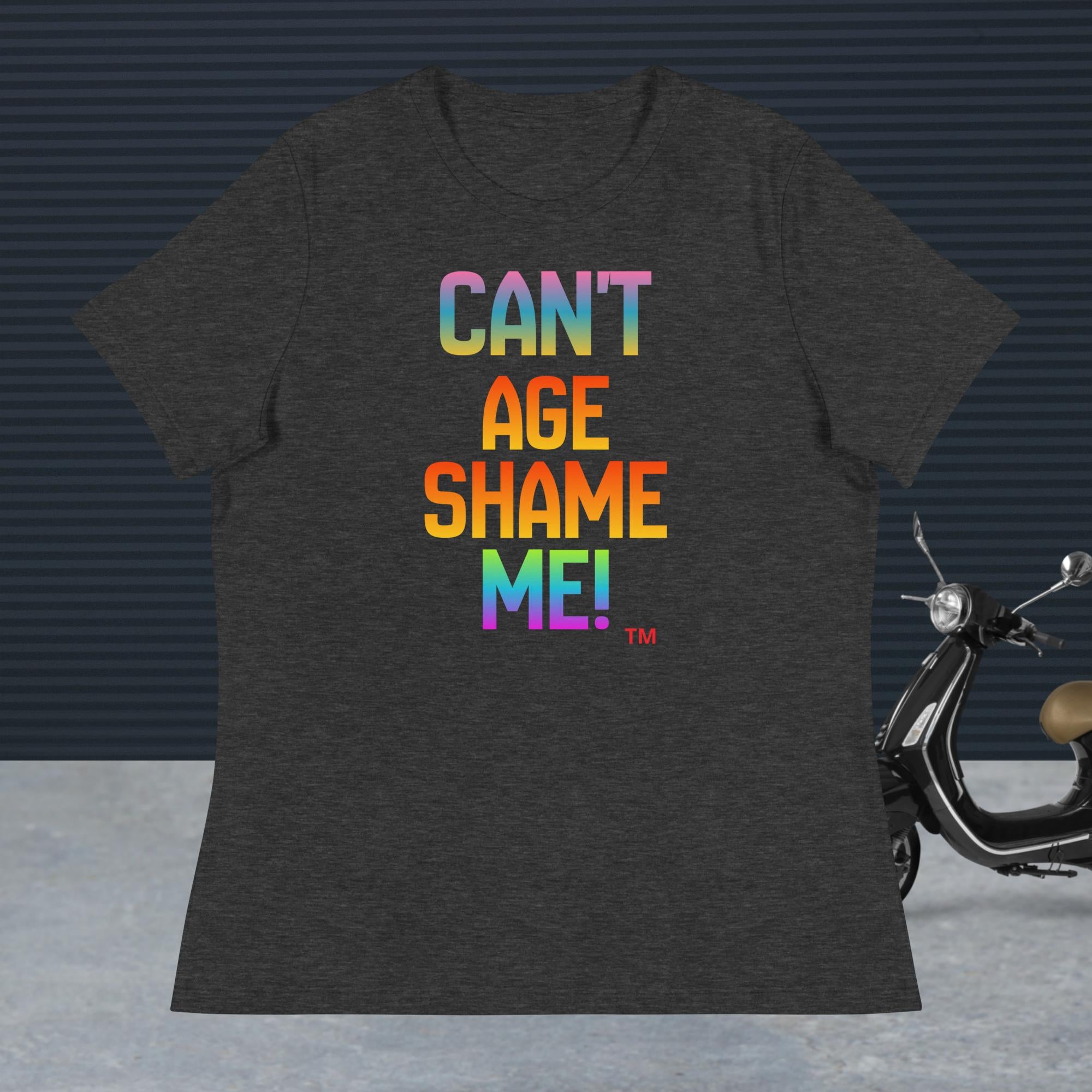 Dark gray heather t-shirt with colorful text 'CAN'T AGE SHAME ME!' on a dark background with a scooter.