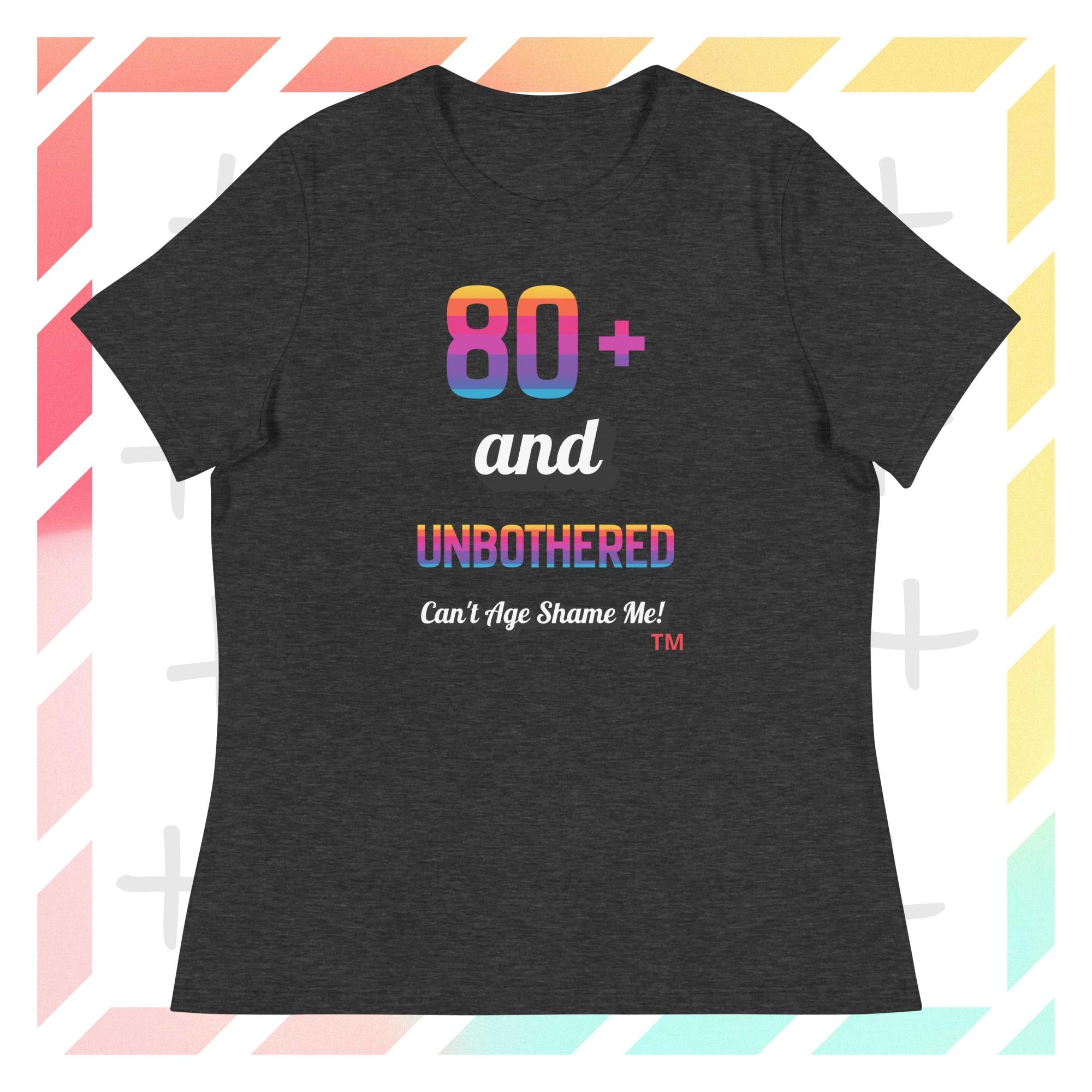 Dark gray t-shirt with colorful text design on a geometric patterned background