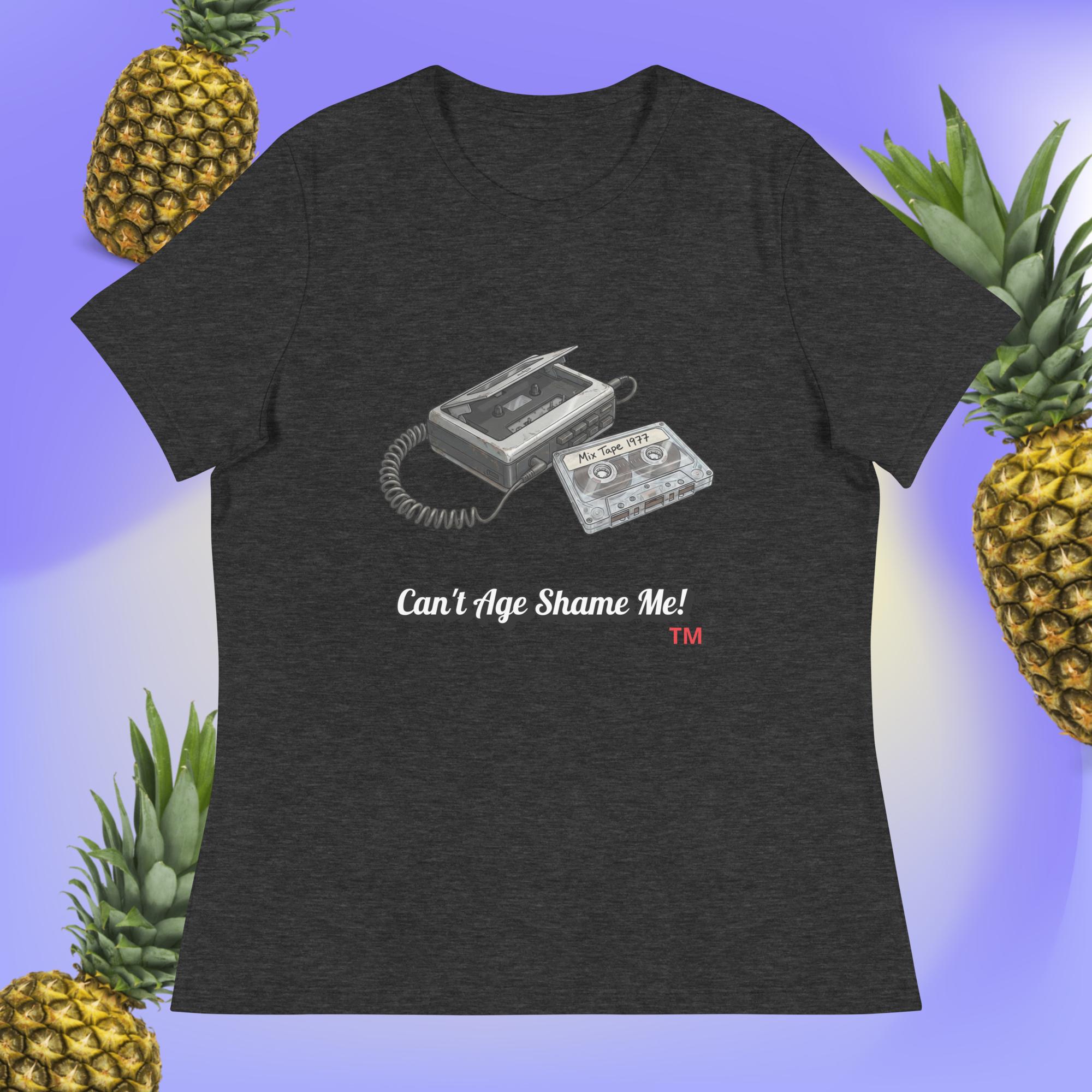 dark gray t-shirt with cassette tape design and text 'Can't Age Shame Me!' on a blue background with pineapples.
