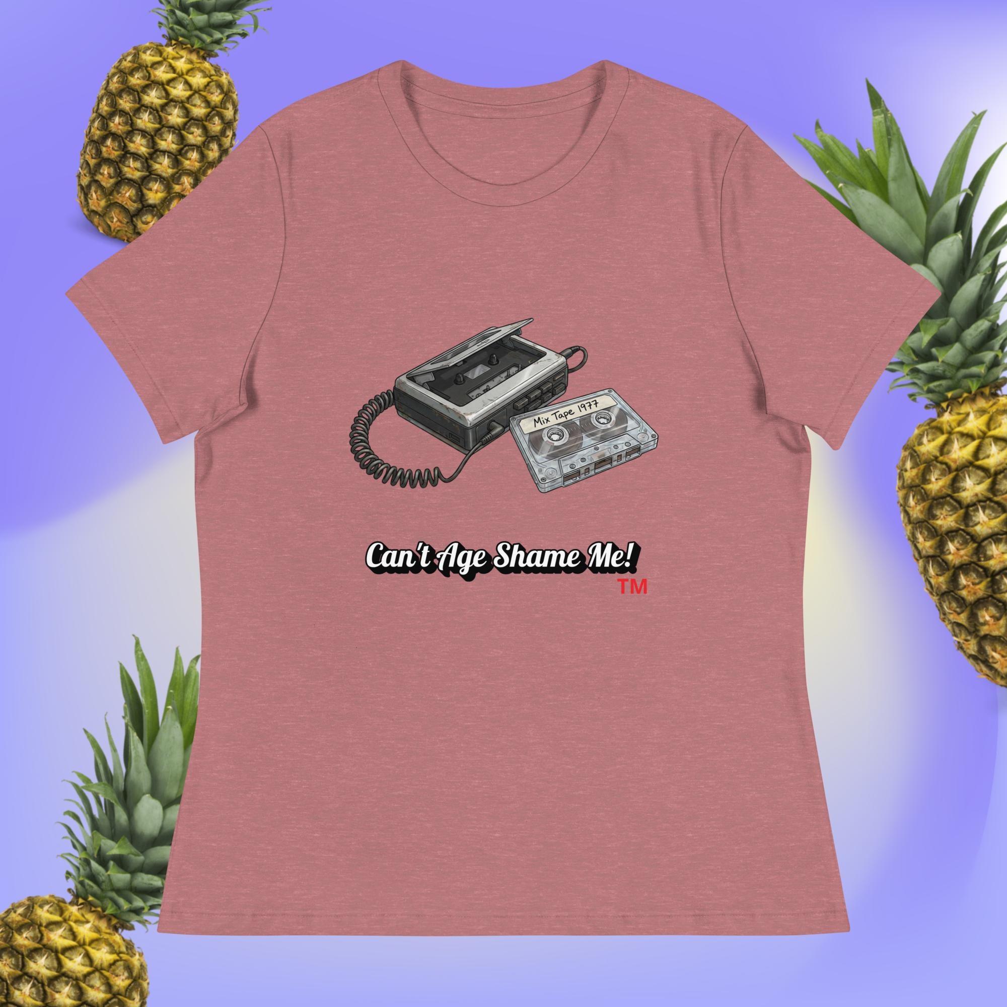 heather mauve t-shirt with a cassette tape graphic and text 'Can't Age Shame Me!' on a blue background with pineapples.
