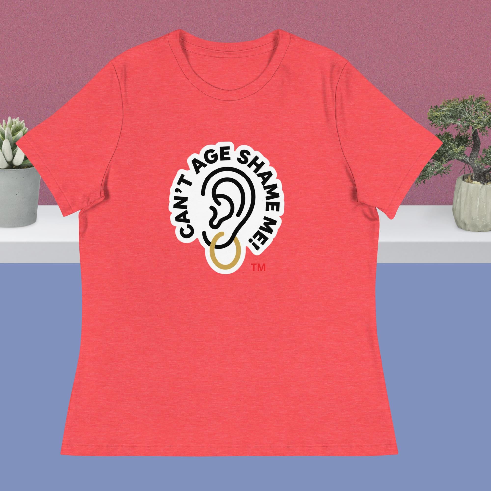 Red t-shirt with 'Can't Age Shame Me' logo on a purple and blue gradient background