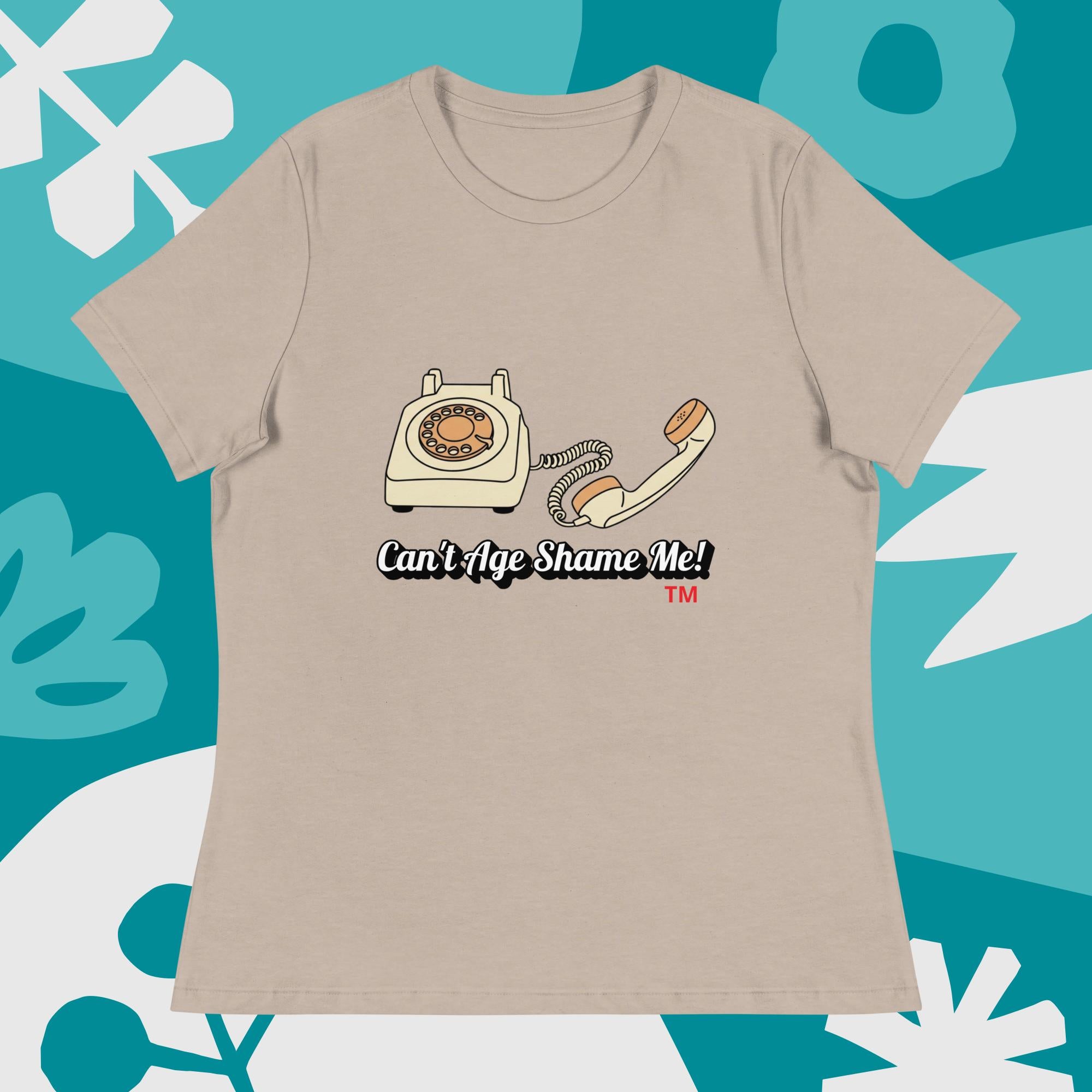 heather stone  t-shirt with a vintage telephone graphic and text  can't age shame me on a blue and white abstract background