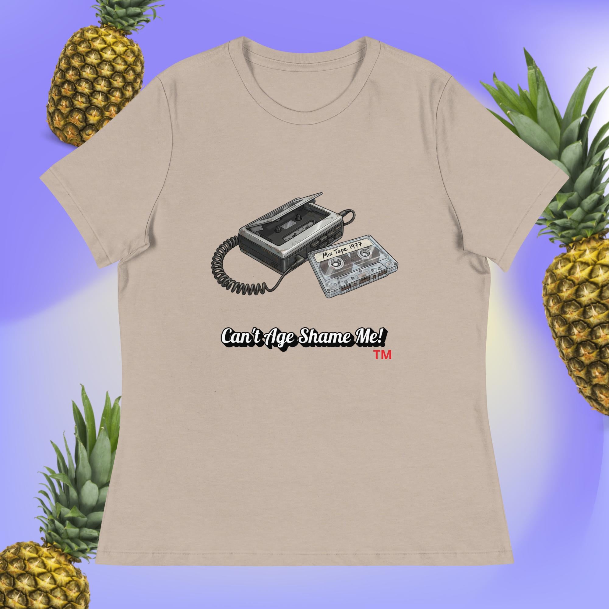 heather stone  t-shirt with a cassette tape design and text 'Can't Age Shame Me!' surrounded by pineapples on a blue background