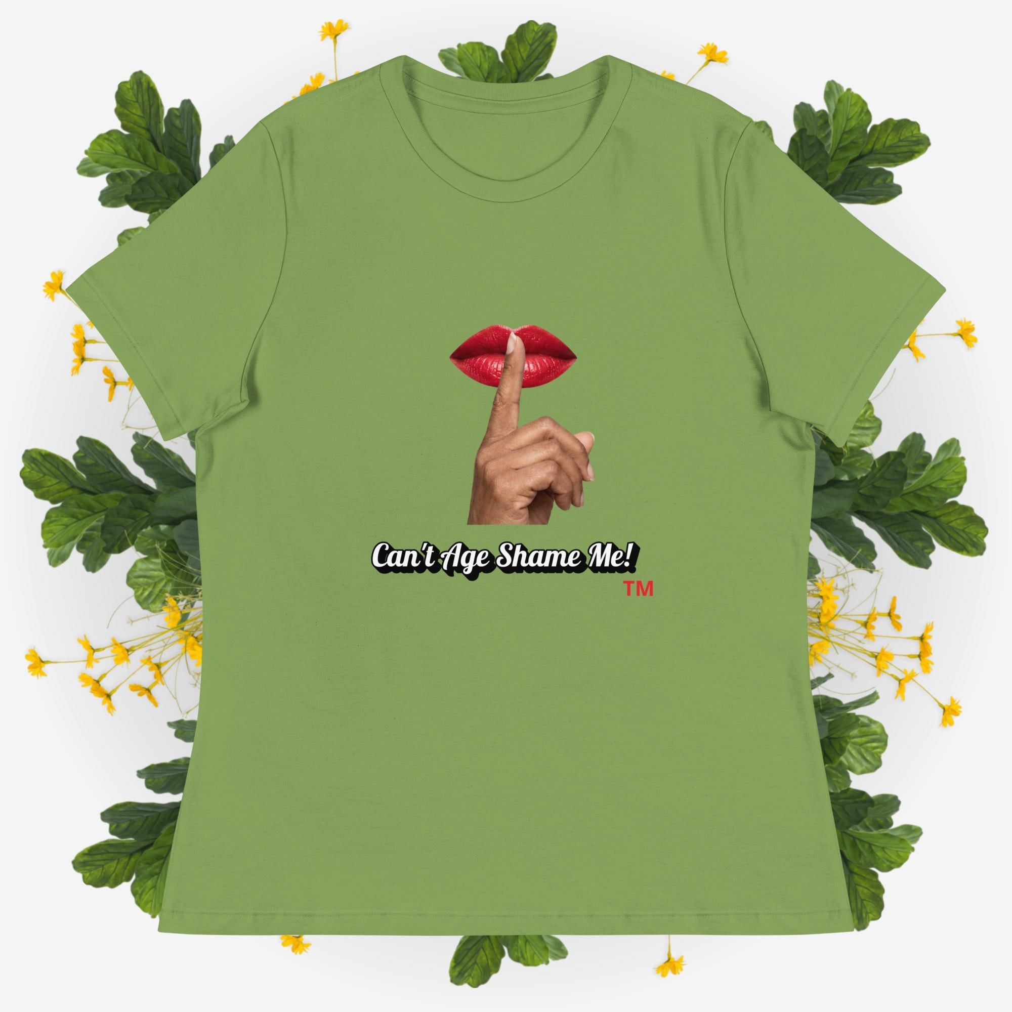 Leaf Green t-shirt with graphic design and text 'Can't Age Shame Me' on a decorative background with leaves and flowers.