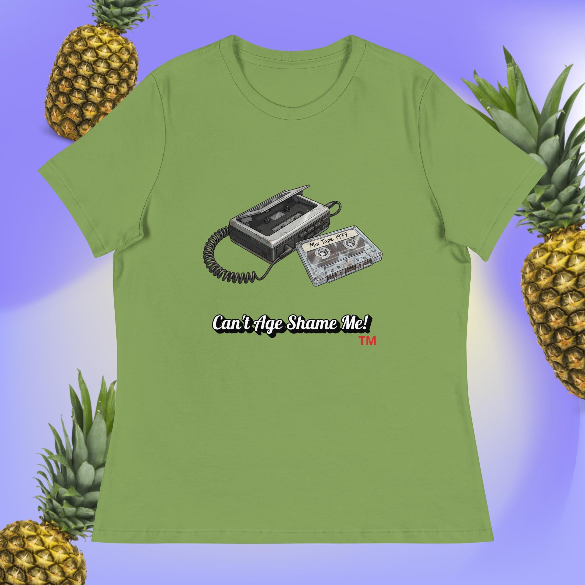 leaf  t-shirt with a cassette tape design and text 'Can't Age Shame Me!' surrounded by pineapples on a gradient background.
