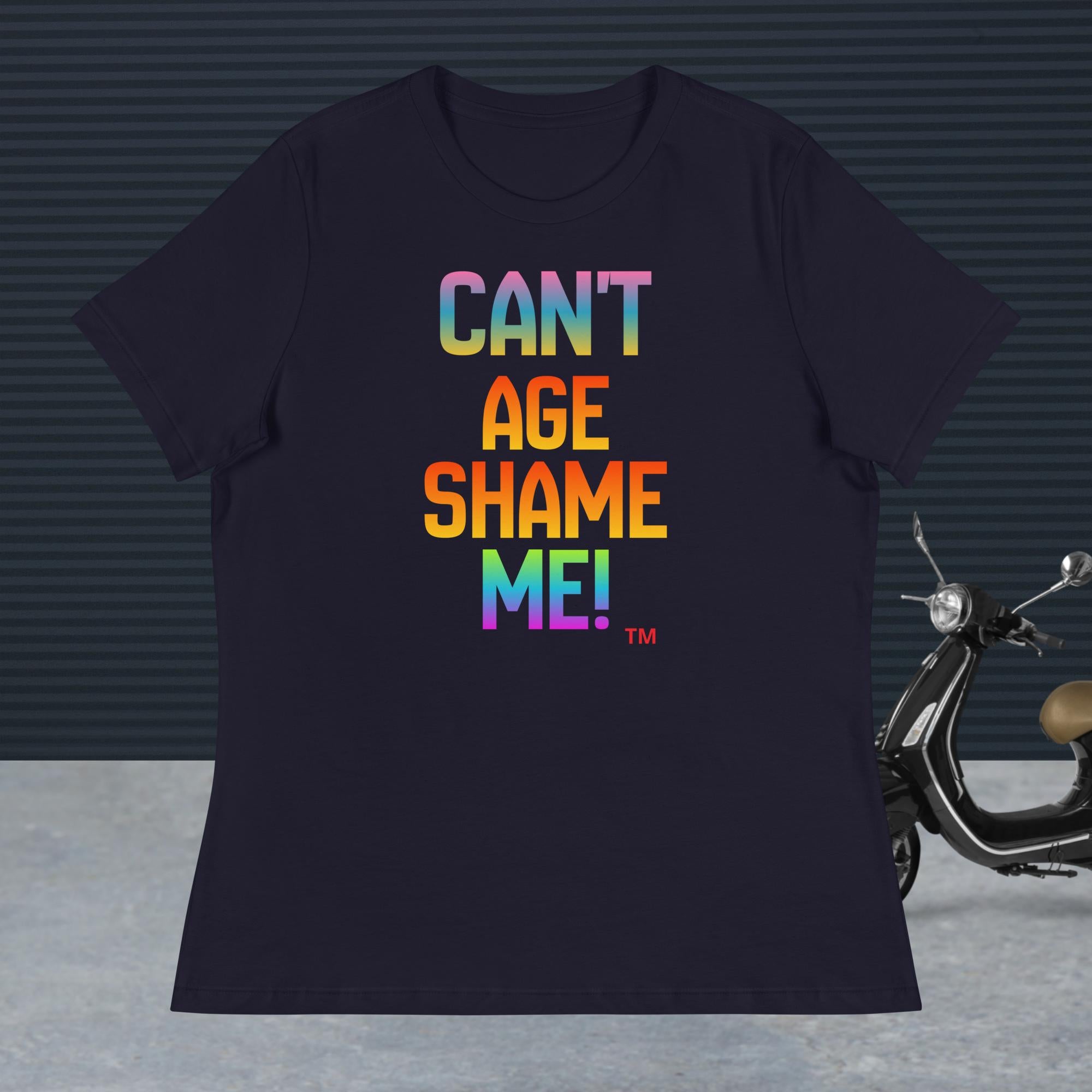 Navy t-shirt with colorful text 'CAN'T AGE SHAME ME!' on a dark background