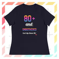 Navy t-shirt with colorful text design on a geometric patterned background