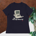 navy  t-shirt with vintage computer graphic and text 'Can't Age Shame Me!' on a wooden surface.