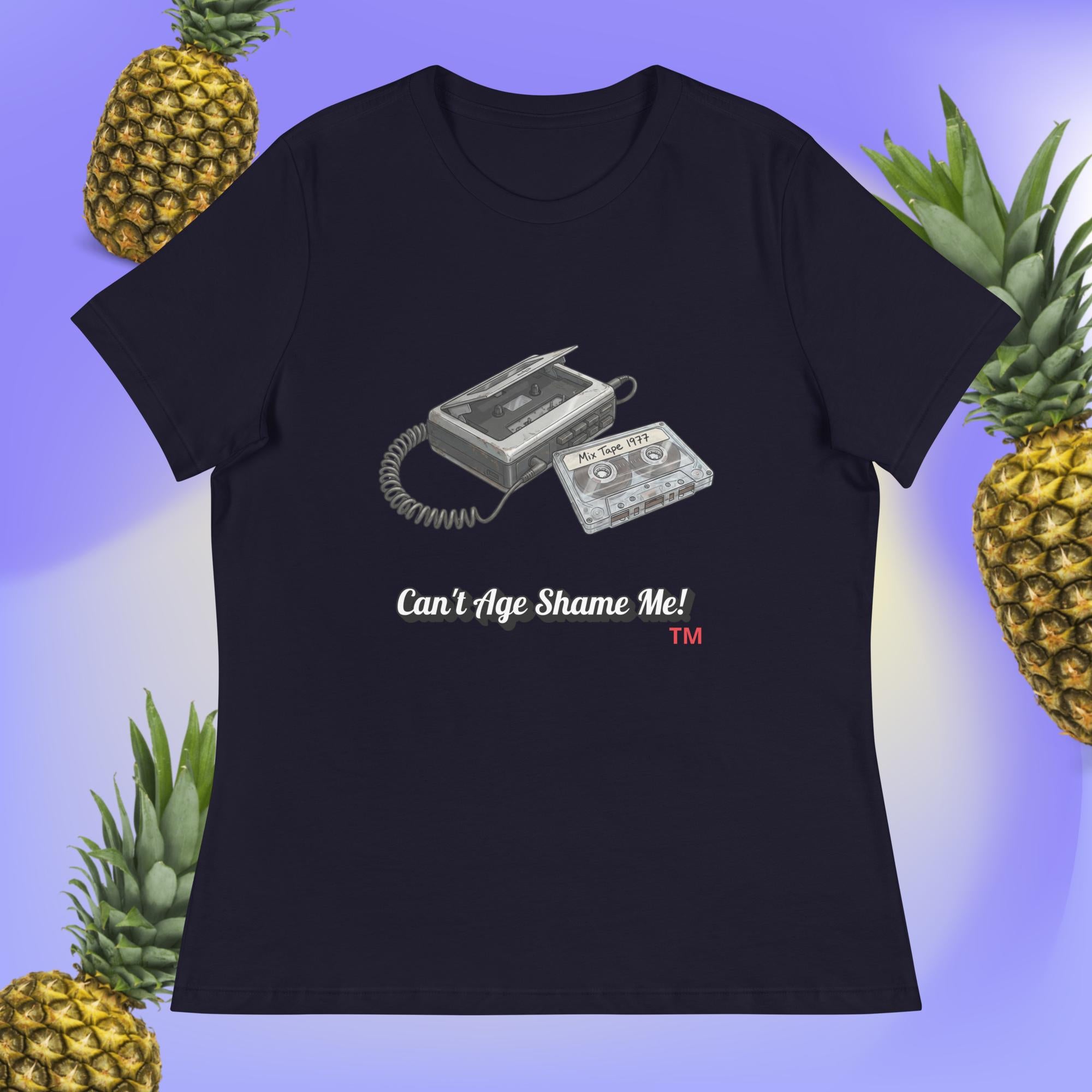 navy t-shirt with cassette tape design and text 'Can't Age Shame Me!' on a blue background with pineapples.