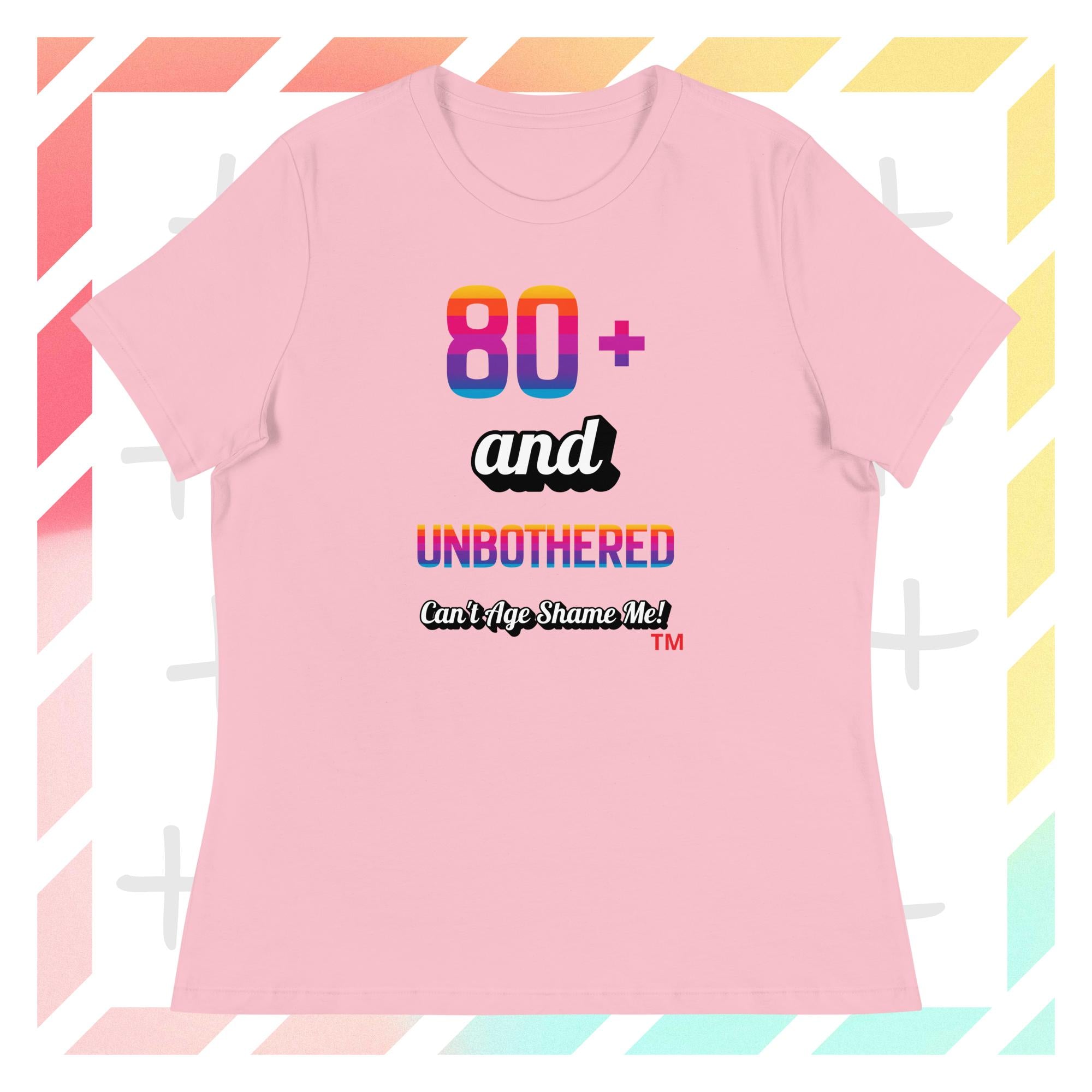 Pink t-shirt with colorful text design on a geometric patterned background