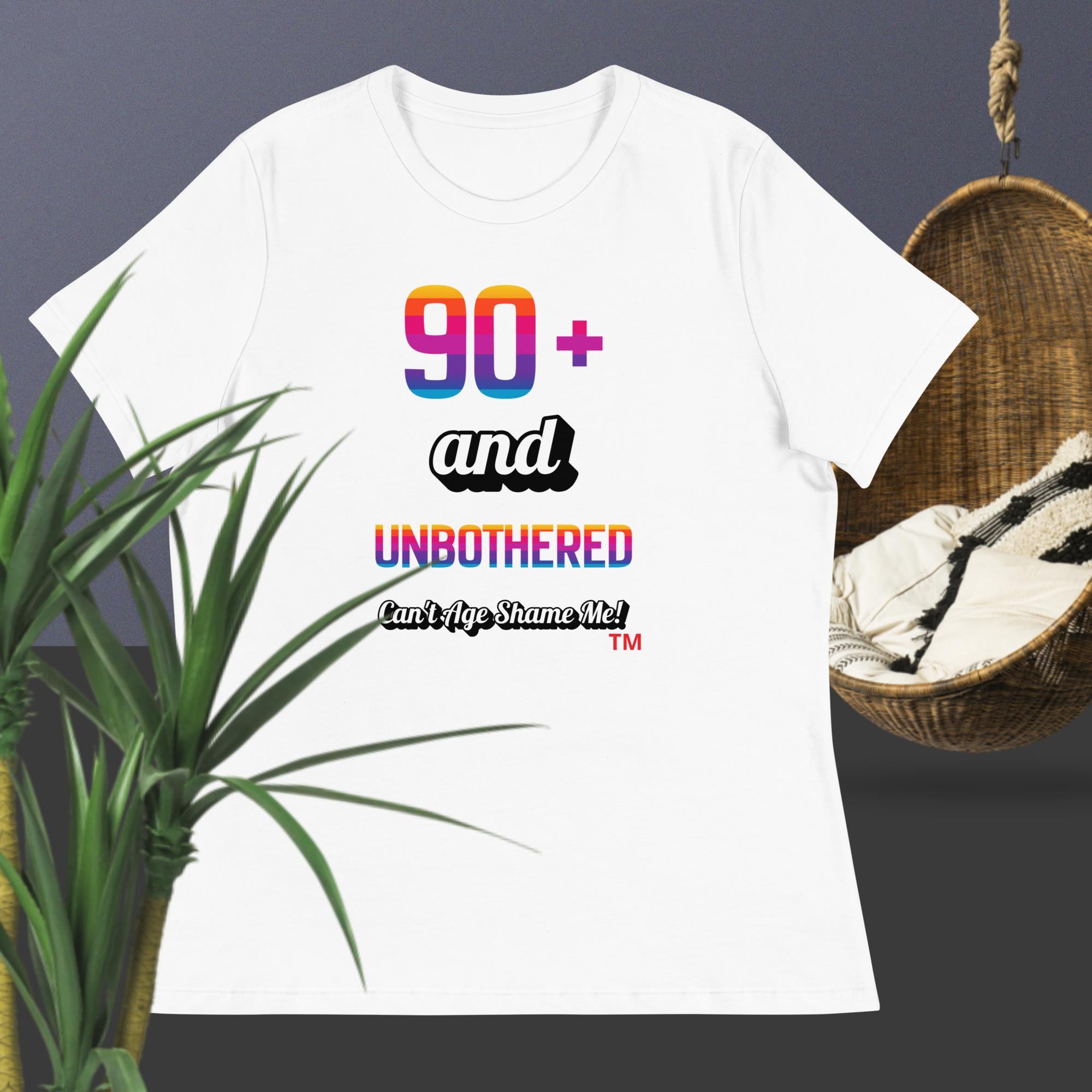 White t-shirt with colorful text design on a dark background